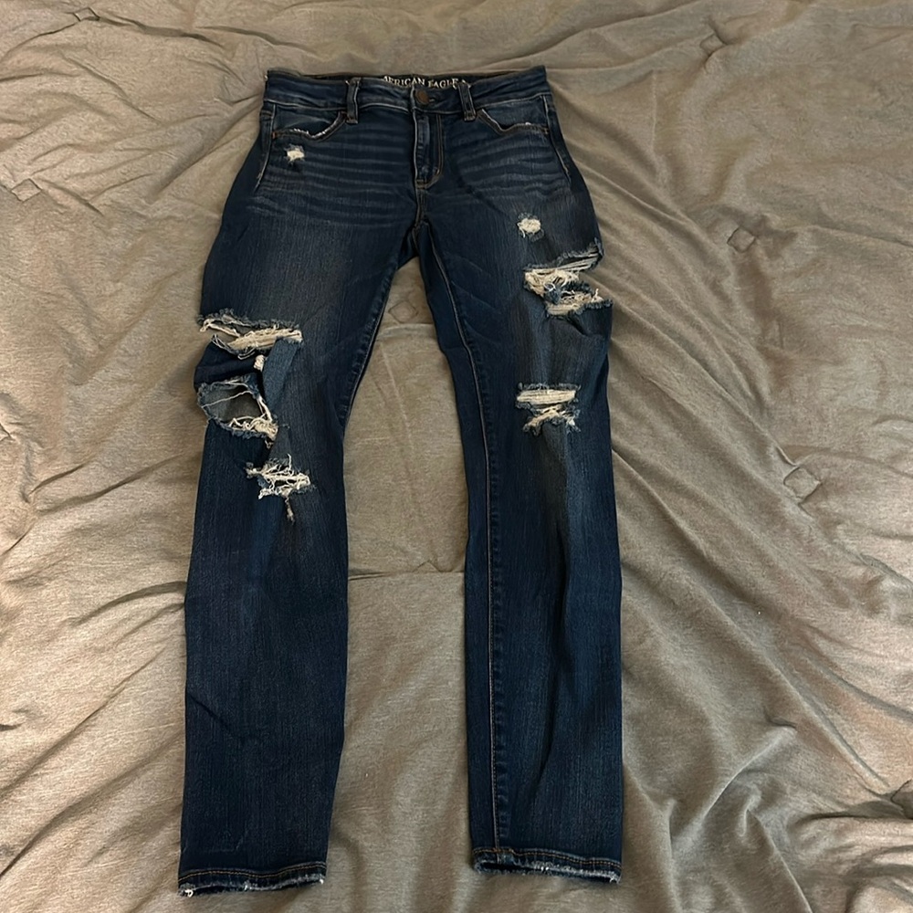 American Eagle, dark wash high-rise jagging size 4 regular holes on side of leg